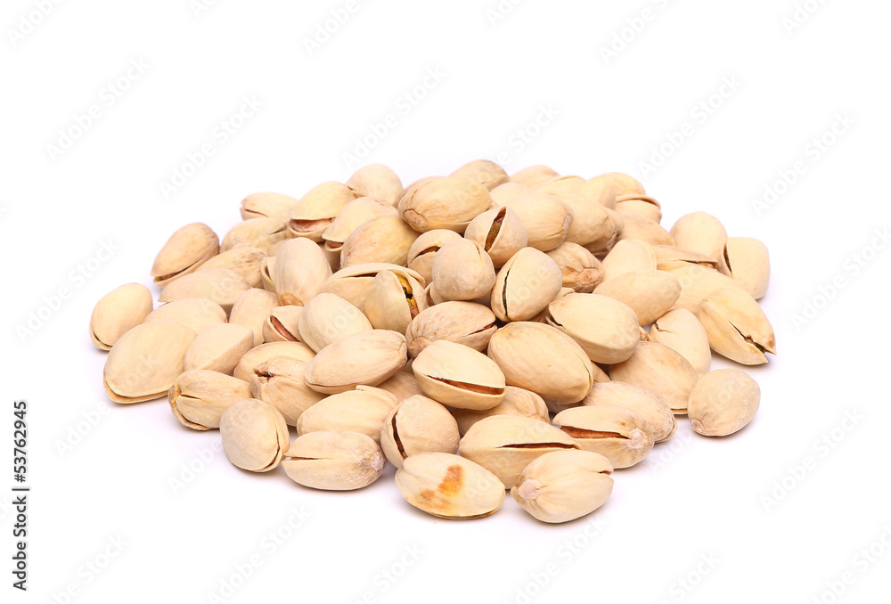 pistachios heap on the white background close-up pistachios heap on the white background close-up