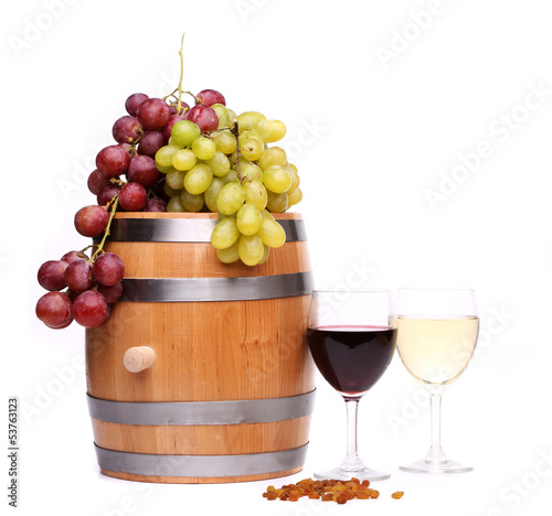 Grape on the barrel, glasses of wine, raisins