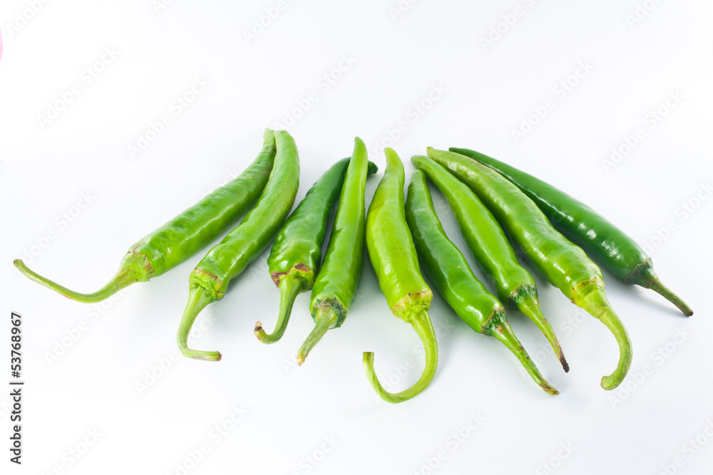 Red and green pepper on a white background Red and green pepper on a white background