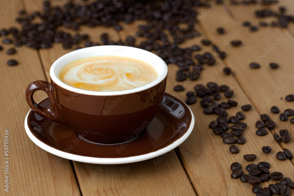 Fototapeta premium cup of coffee on wooden background