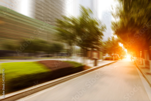 road in city with sunset