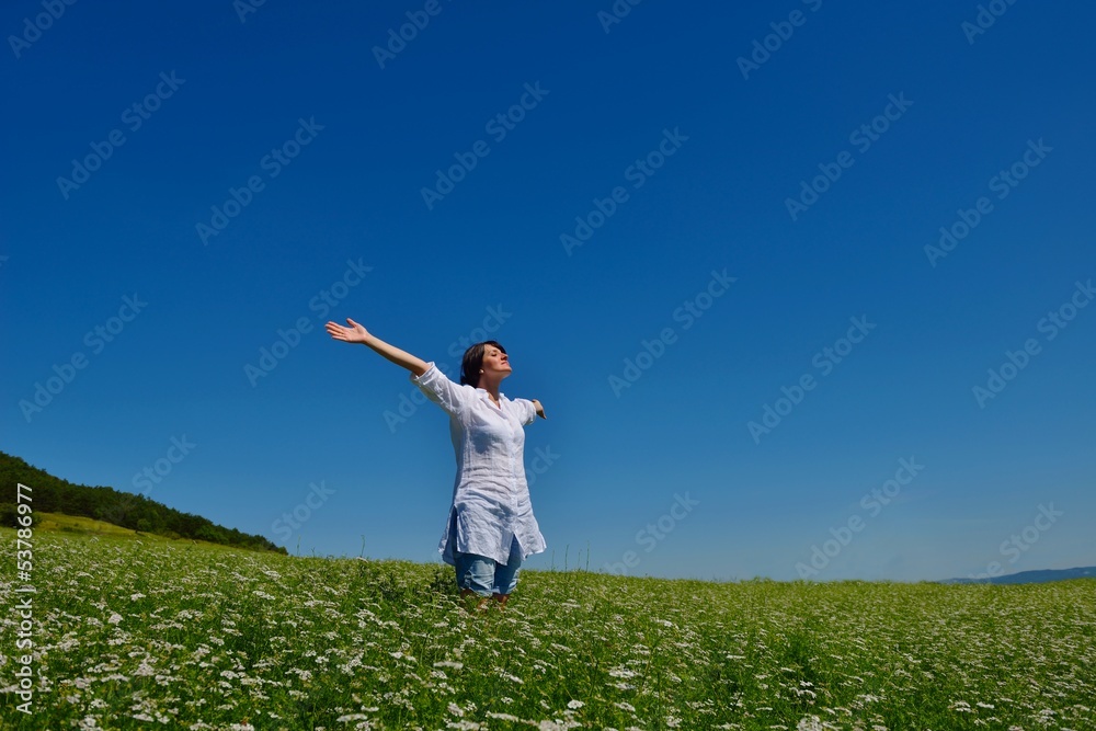 young woman with spreading arms to sky young woman with spreading arms to sky