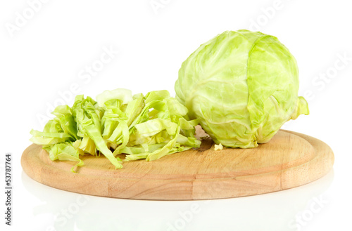 Green cabbage sliced on cutting board, isolated on white