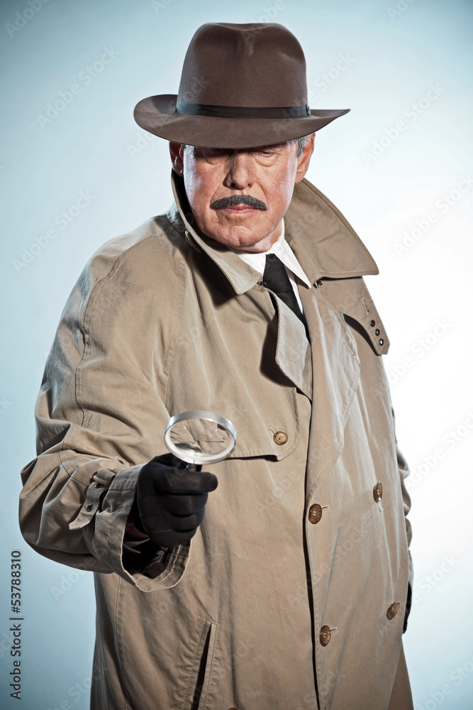 Retro detective with mustache and hat. Looking through magnifyin Retro detective with mustache and hat. Looking through magnifyin
