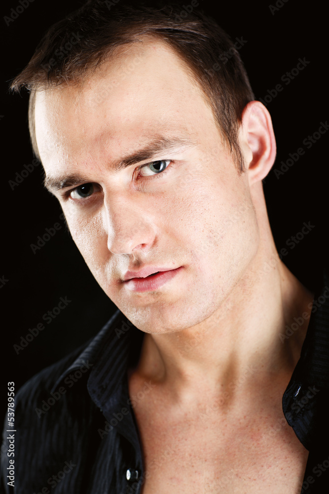 Portrait of a muscular man, isolated on black background Portrait of a muscular man, isolated on black background