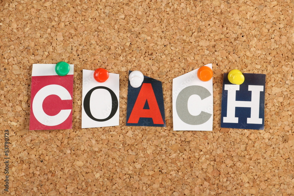The word Coach on a cork notice board The word Coach on a cork notice board