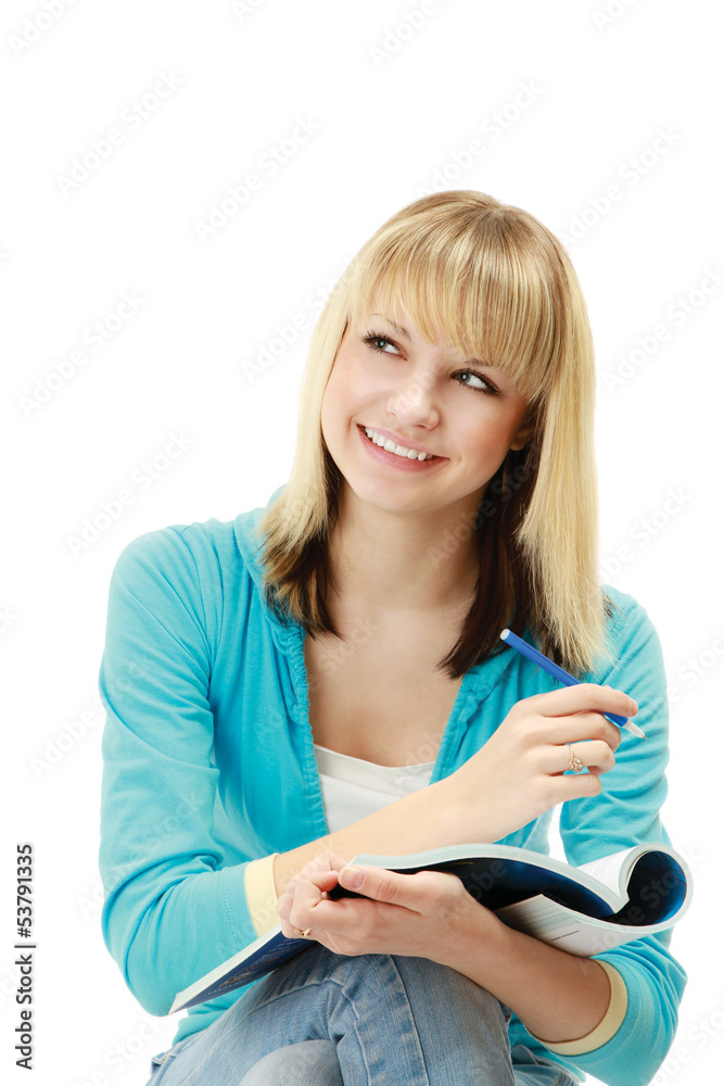 A pensive college girl with a pen and a textbook A pensive college girl with a pen and a textbook