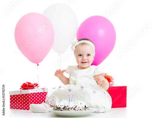 Joyful baby girl with cake,...