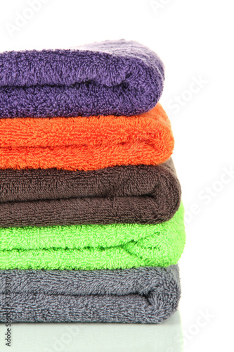 Pile of colorful towels, isolated on white