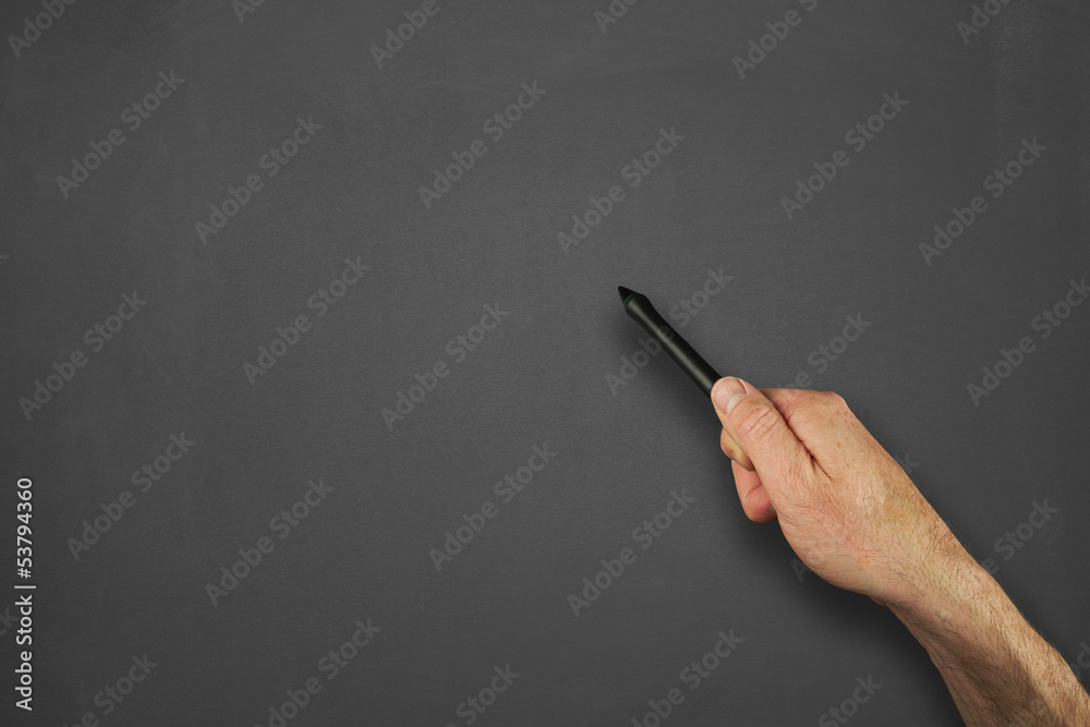 Hands in front of chalkboard