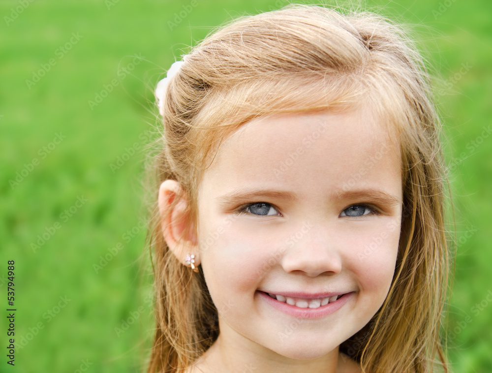 Outdoor portrait of adorable smiling little girl Outdoor portrait of adorable smiling little girl