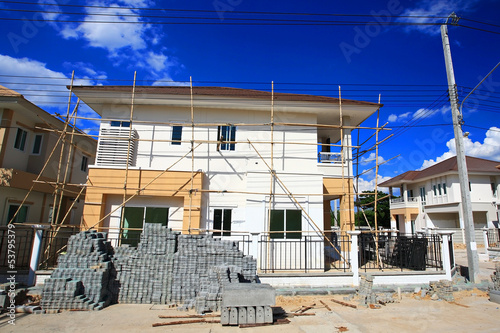 luxury house under construction against blue sky