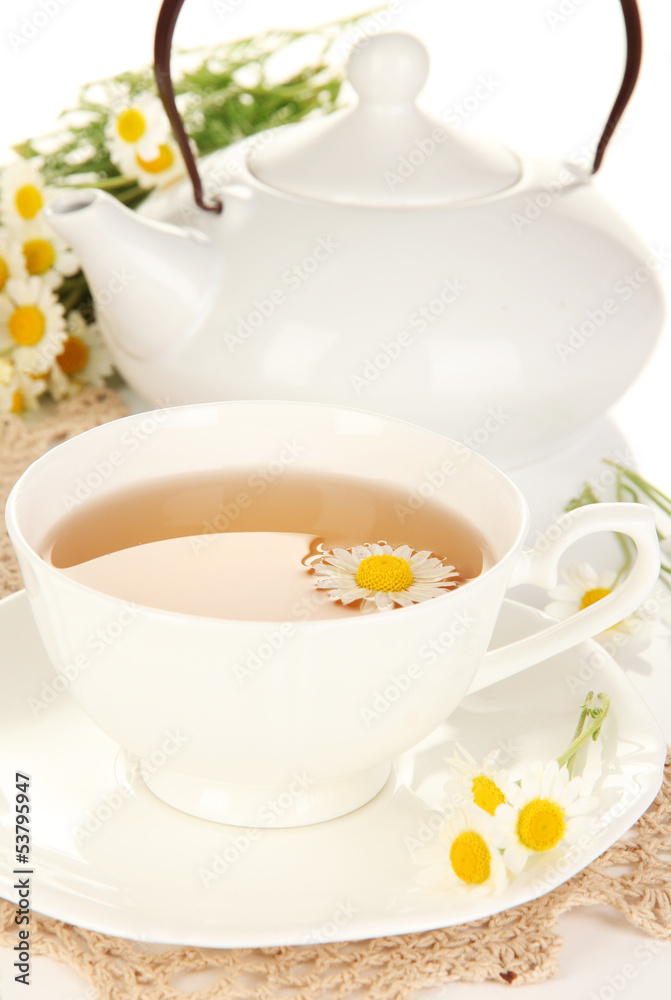 Cup of herbal tea with camomiles close up Cup of herbal tea with camomiles close up