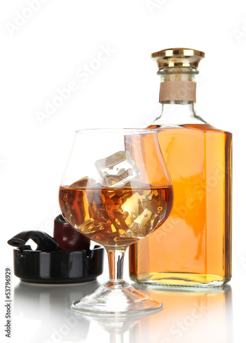 Brandy with ice and cigar isolated on white
