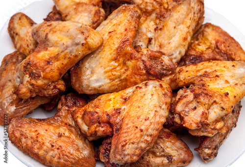 Plate of delicious barbecue chicken wings © Igor Borodin