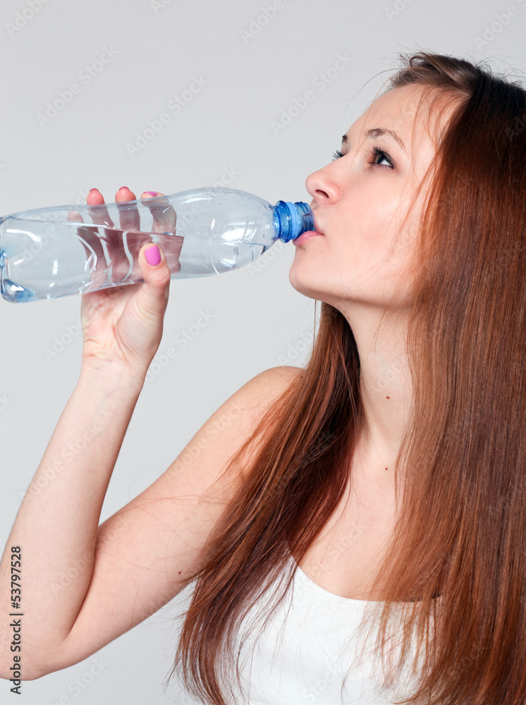 young happy smiling brunette woman in sportswear drinking young happy smiling brunette woman in sportswear drinking