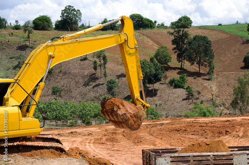 Backhoe loader loading dumper photo