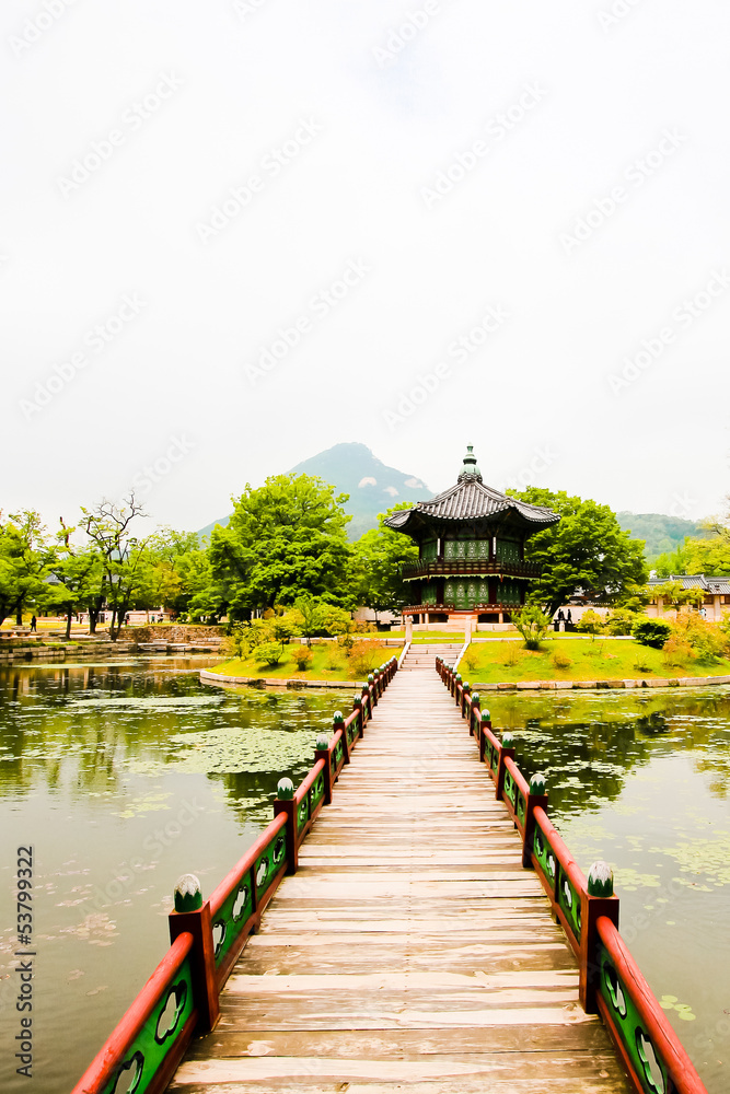 Naklejka premium A bridge leading out to a oriental style pagoda