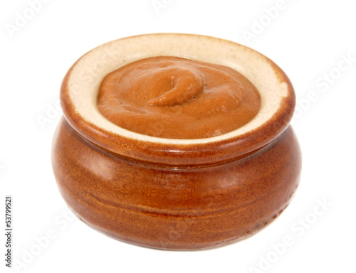 French mustard served in a small ceramic pot