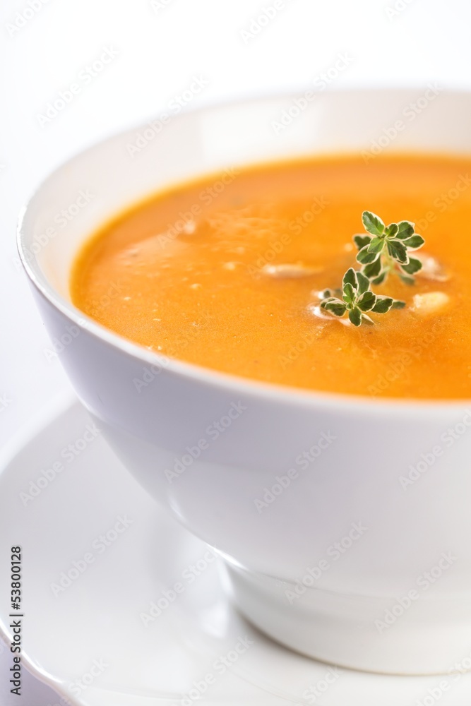 Bowl with pumpkin soup on white background Bowl with pumpkin soup on white background