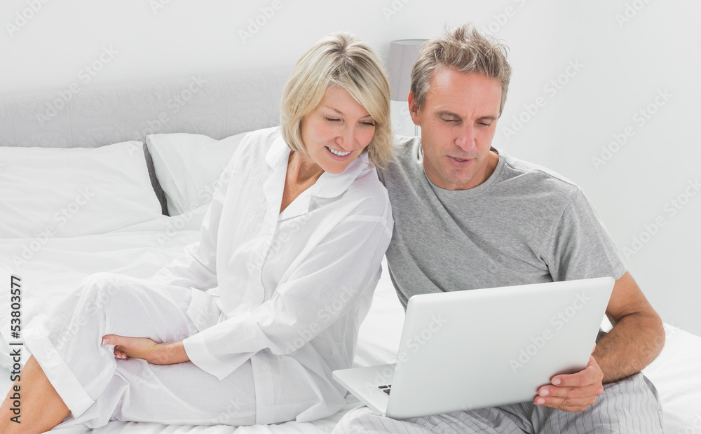 Couple using their laptop Couple using their laptop