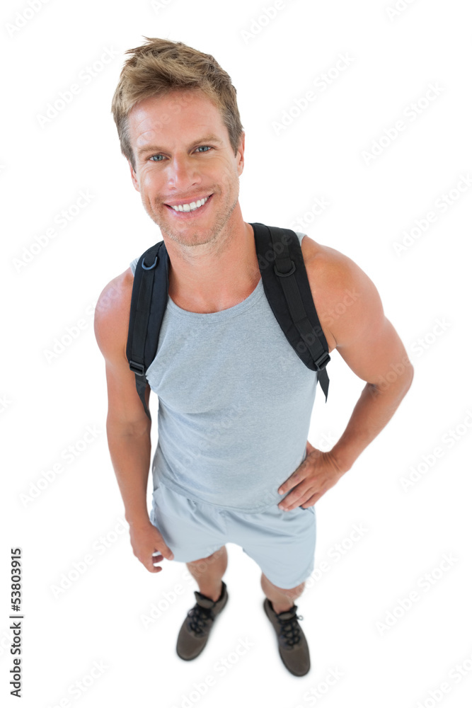 Attractive man in sportswear with hands on hips
