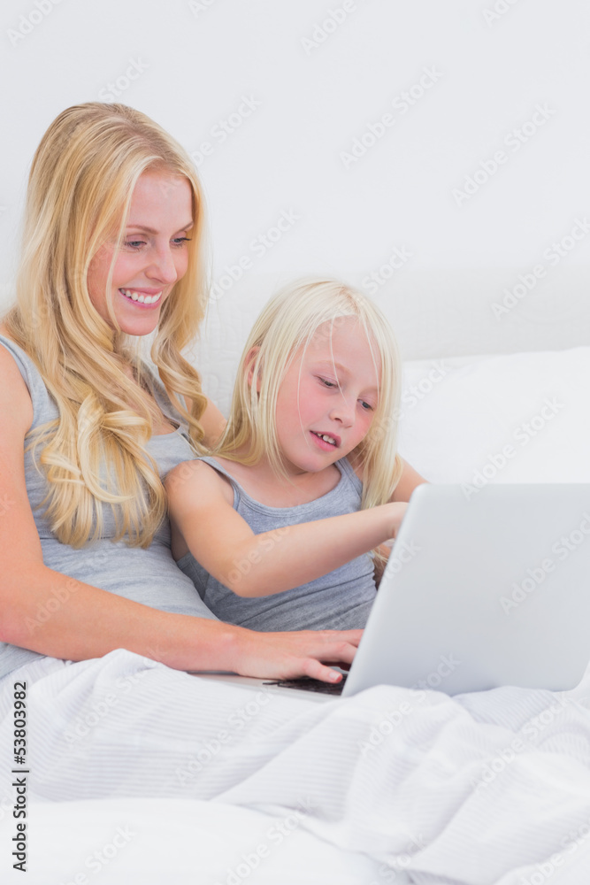 Mom and daughter using a laptop Mom and daughter using a laptop