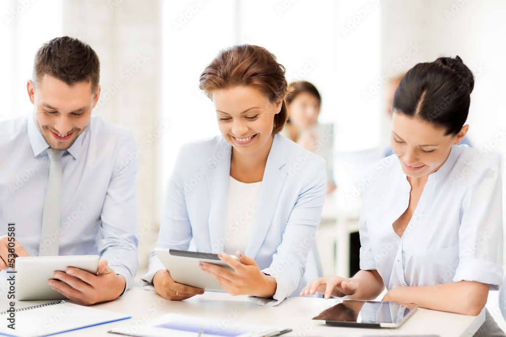 business team working with tablet pcs in office business team working with tablet pcs in office