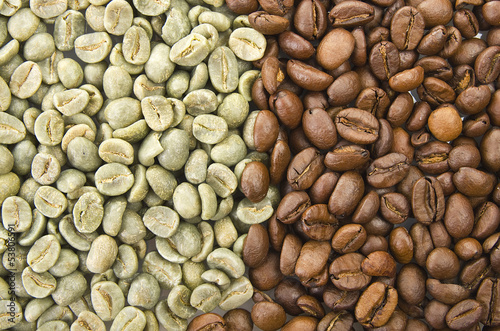 Coffee beans raw and toasted close up on the white