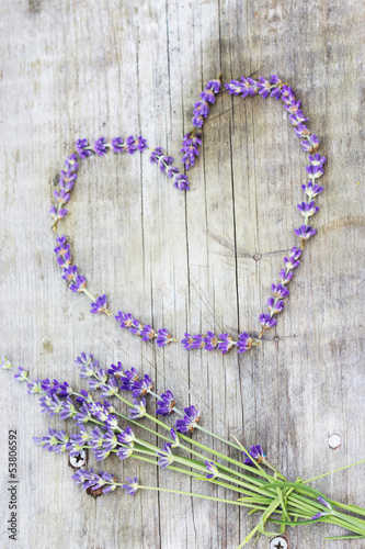 Lavender heart over wooden background. With copy-space