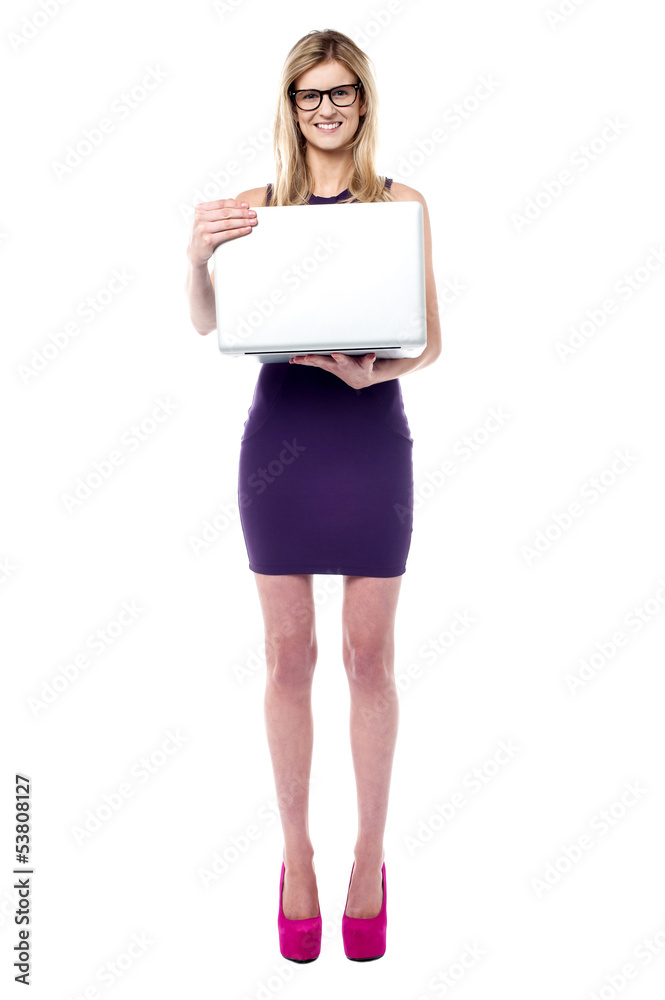 Attractive sales girl holding laptop Attractive sales girl holding laptop