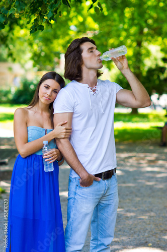 young couple drinks water