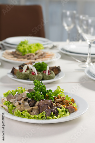 plate with mushrooms salad greens