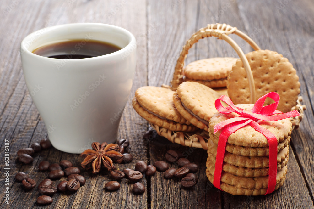 Sweet cookies tied ribbon and cup of coffee Sweet cookies tied ribbon and cup of coffee