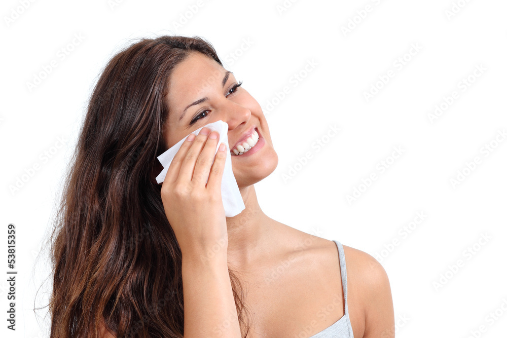 Attractive woman cleaning her face with a tissue Attractive woman cleaning her face with a tissue