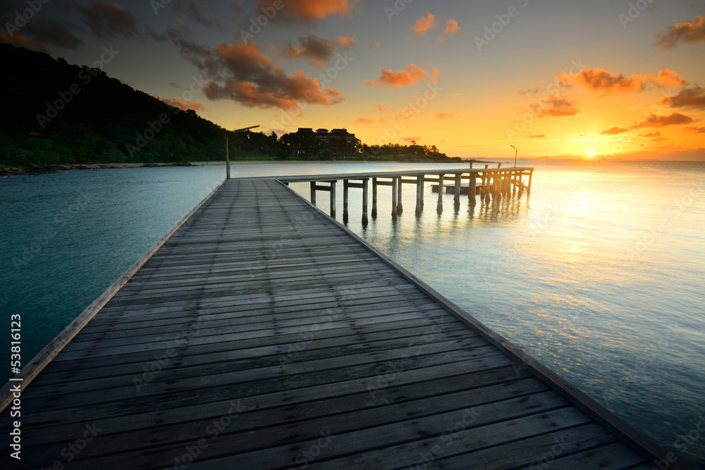 Fototapeta premium The beautiful wooden bridge.with sunrise at national park Khao L