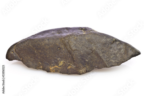 Black stone arrowhead isolated on white photo