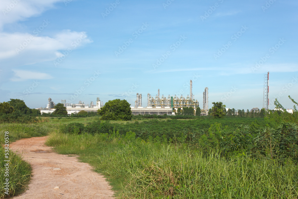 Oil refinery on blue sky background.