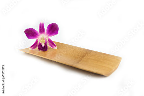 Canvas Print Purple orchid in bamboo dish.
