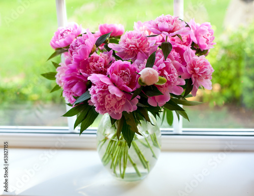 Fototapeta Naklejka Na Ścianę i Meble -  pink peonies on window sill