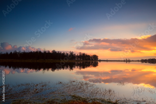 calm sunset over lake surface