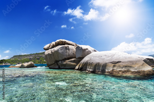 Big rock on sunny beach. Seychelles island.