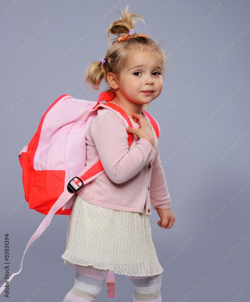 Funny little school girl with a backpack Funny little school girl with a backpack