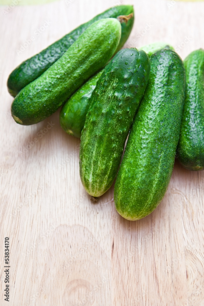 Green cucumber on the board