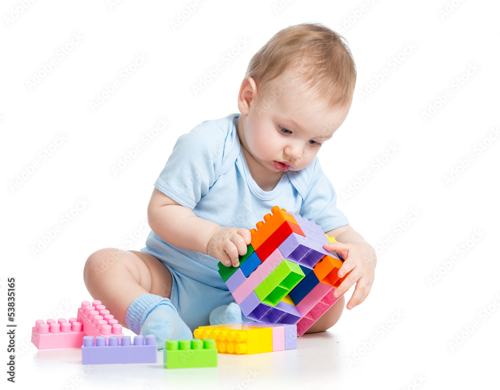 child boy playing with block toy over white background child boy playing with block toy over white background