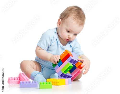 child boy playing with bloc...