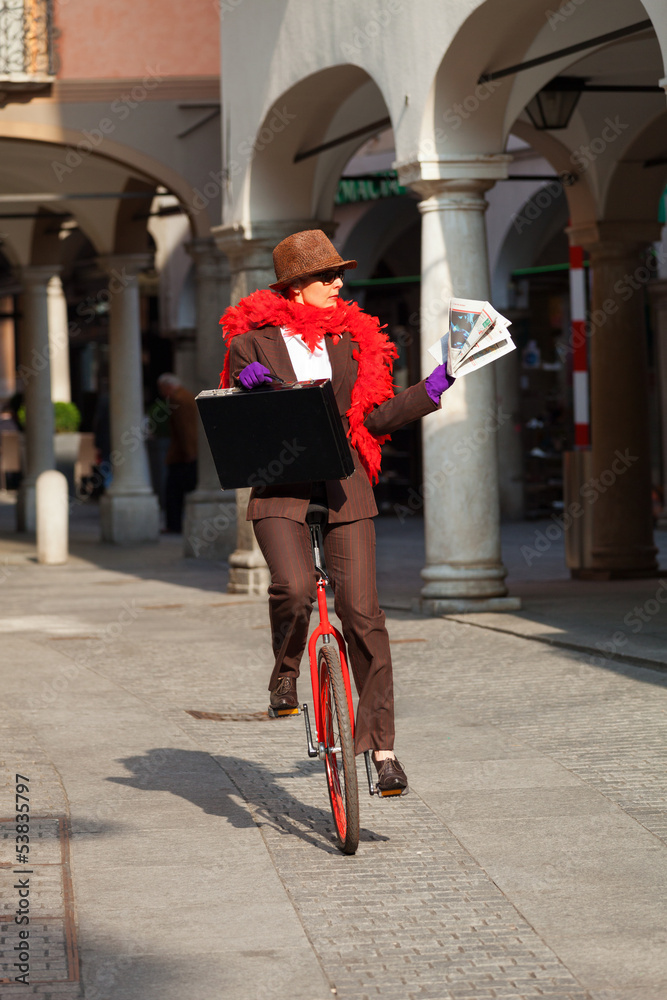 Fototapeta premium business woman go to work in monocycle