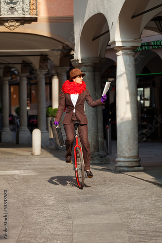 business woman go to work in monocycle photo