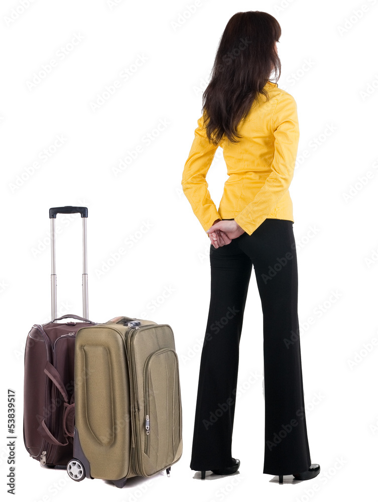Back view of traveling business woman with suitcase. Back view of traveling business woman with suitcase.