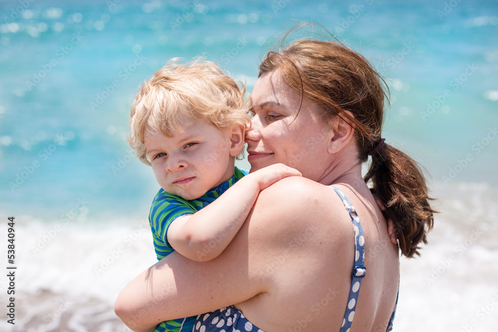 Portrait of mother and her little son on the beach Portrait of mother and her little son on the beach